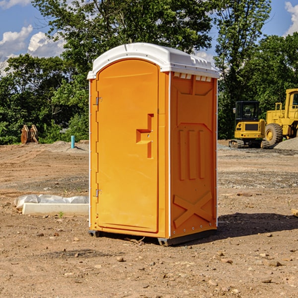 what is the cost difference between standard and deluxe portable restroom rentals in Bland County